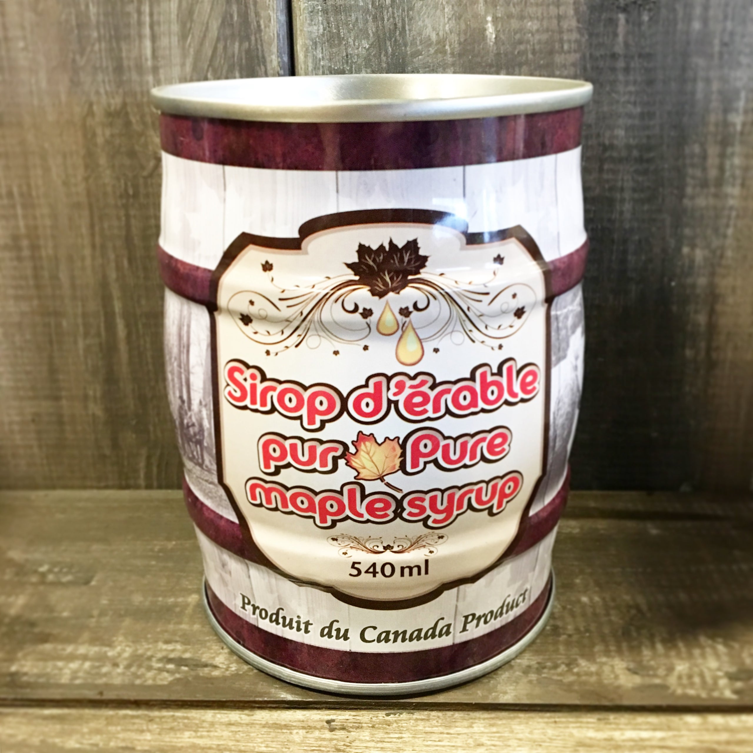 Barrel style can of maple syrup